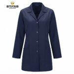 Navy blue lab coat with long sleeves, front button closure, and two large lower pockets, displayed against a white background (Staris Workwear logo top left).